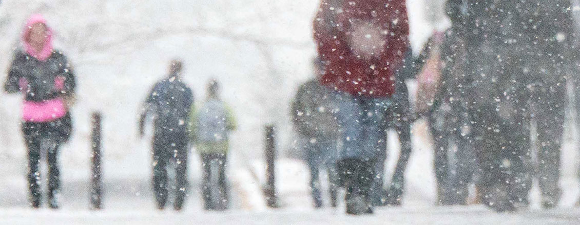 Students walking in a snowstorm