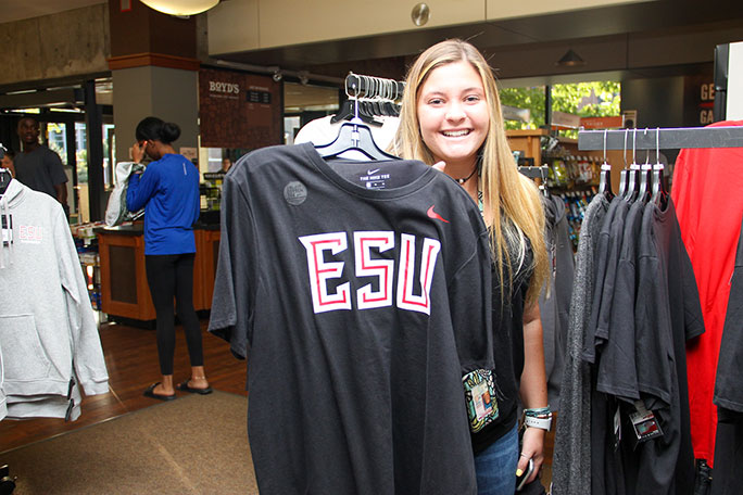 Student holding ESU apparel