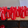 red megaphones stack on table with warriors printed on them