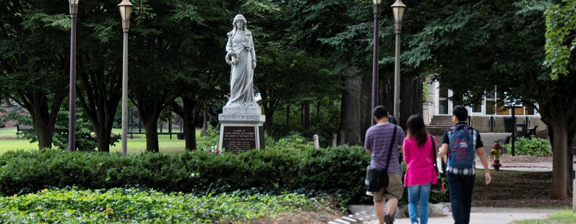 ESU's Julia statue with students walking past