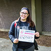 student holding sign