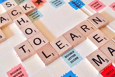 Scrabble tiles spelling the words school and learn