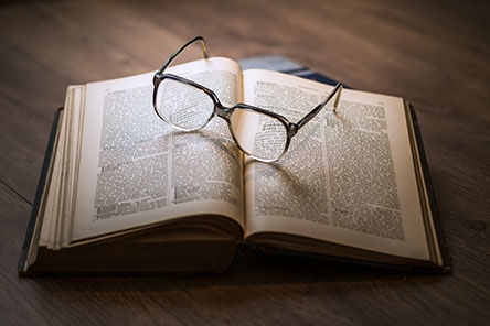 Eyeglasses upon an open book