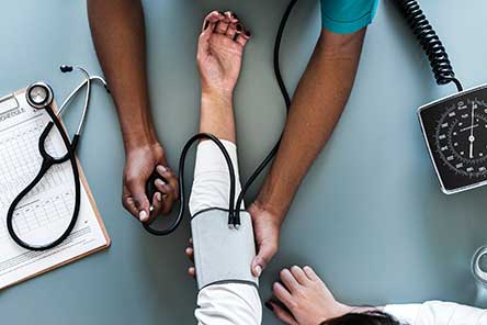 a stethoscope testing blood pressure