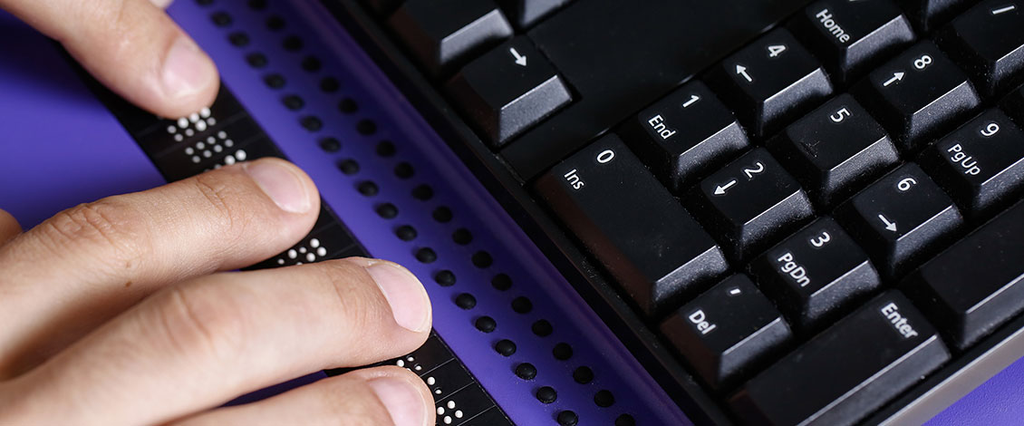 Hands using an assistive technology keyboard