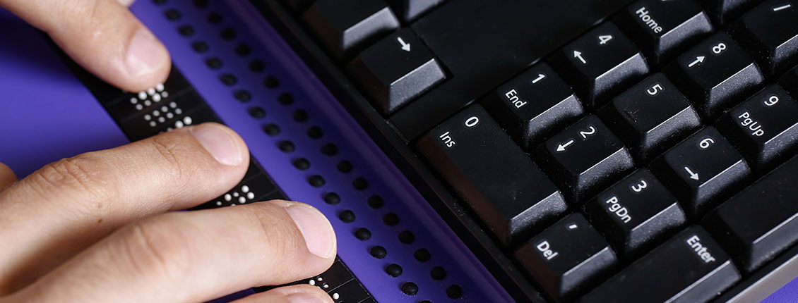 Hands using an assistive technology keyboard