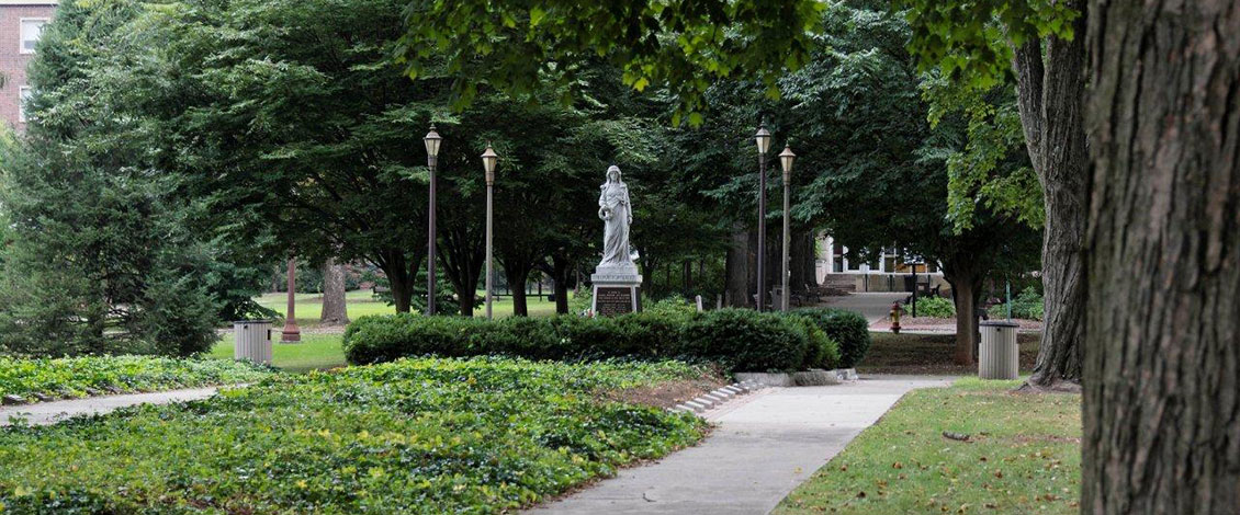 Statue of Julia on a green summer day