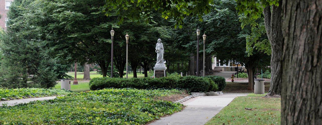 Statue of Julia on a green summer day