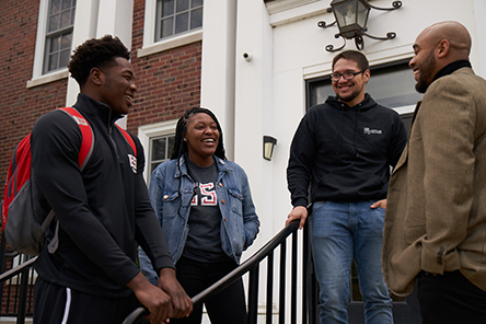 Students talking with Dean Williams