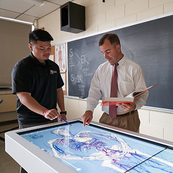 Student talking with Professor