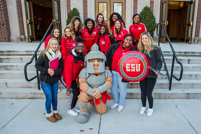 student in a group with the mascot