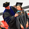 Student and professor on graduation day.