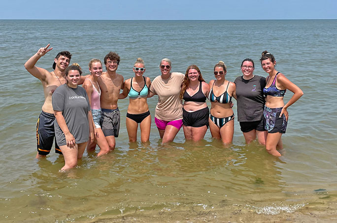 students in the ocean at field station