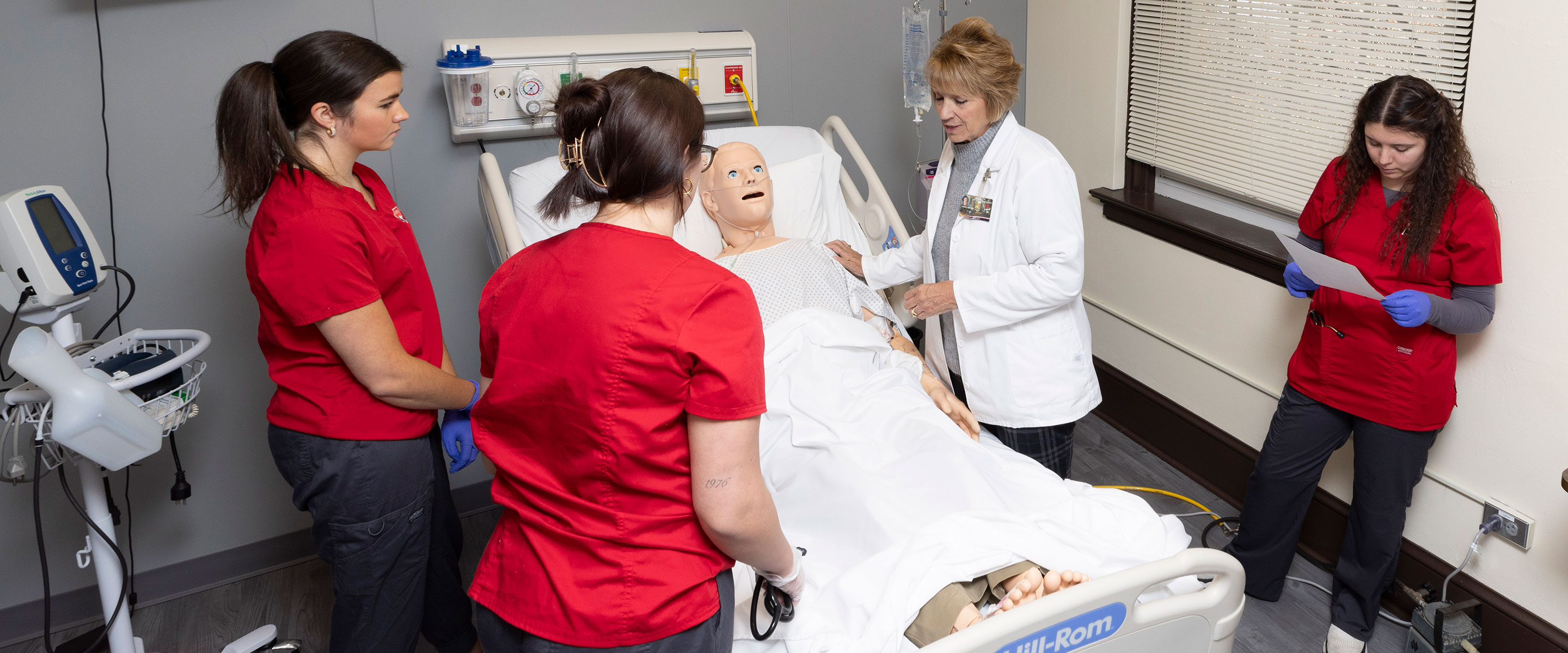 nursing student in the sym lab