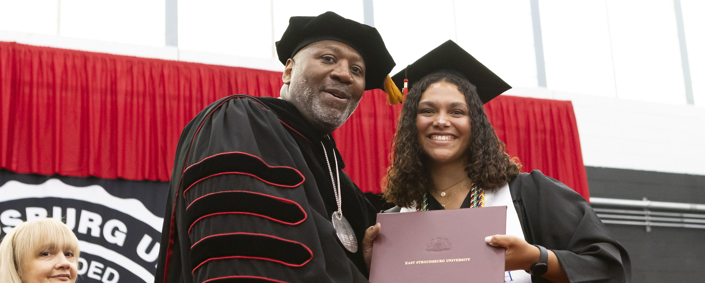 president long with graduate student during commencement