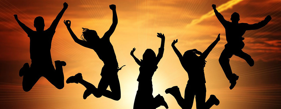 people leaping into air for joy