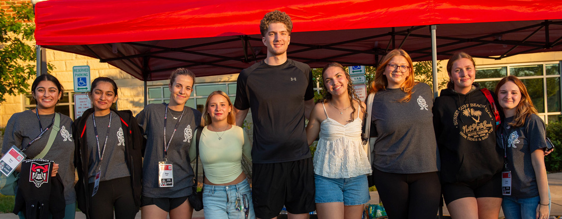 A group of students at a cookout on campus