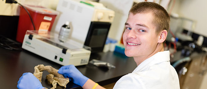 Eric Januszkiewicz working the lab