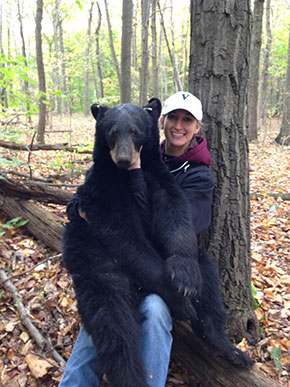 Graduate student Nicole Chinnici holding a NJ black bear