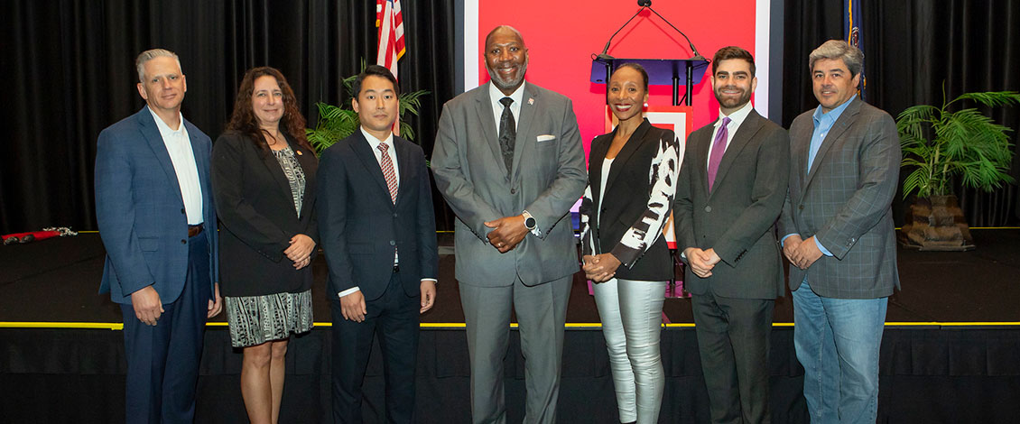 Economic Outlook Summit speakers with president long