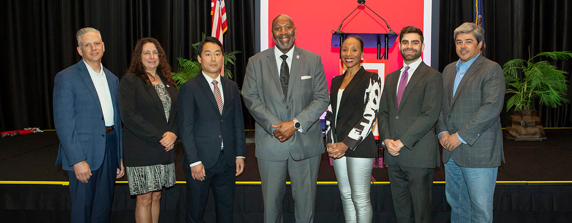 Economic Outlook Summit speakers with president long