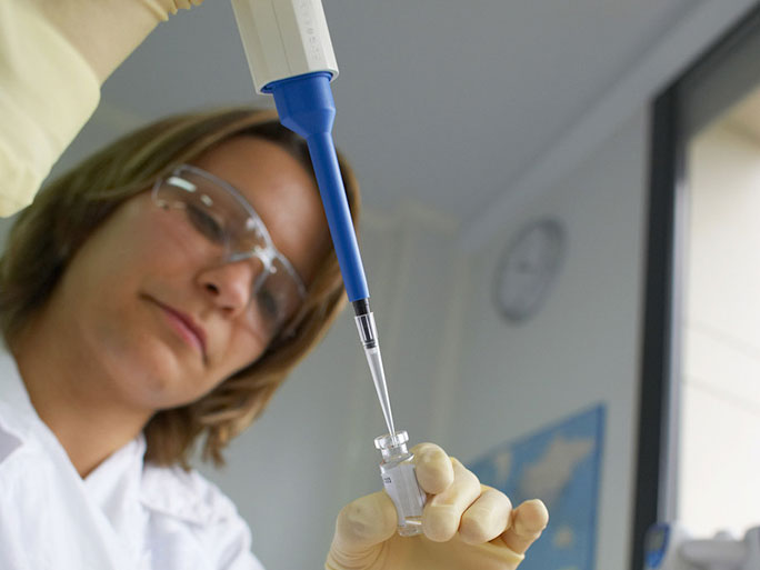 Sanofi is a well-known pharmaceutical company in Monroe County. Lab employee pictured is developing vaccines.