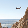 A person jumping off a cliff