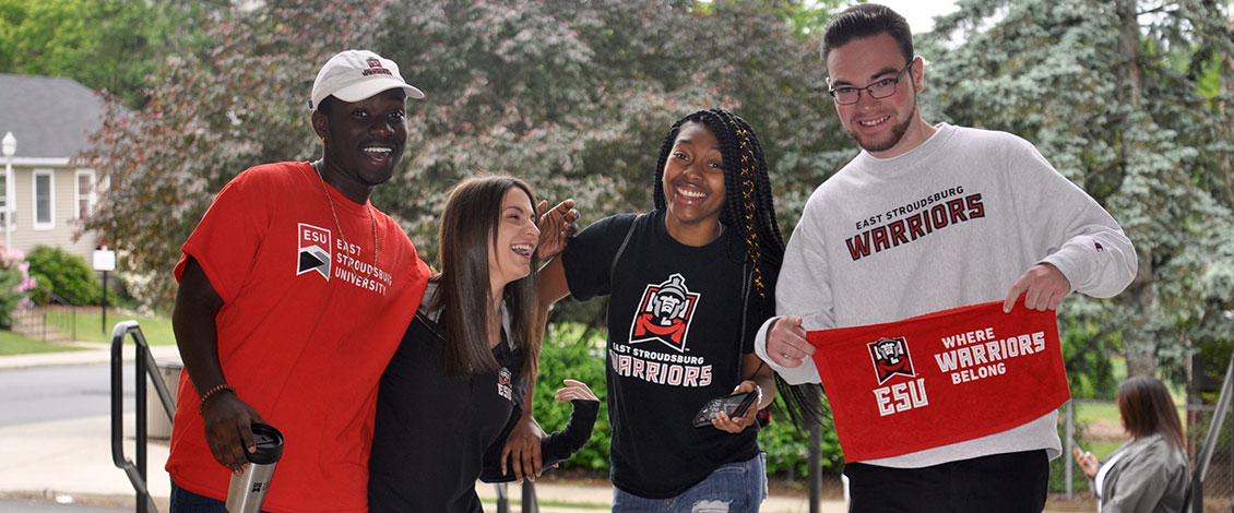 4 Students laughing and wearing ESU shirts