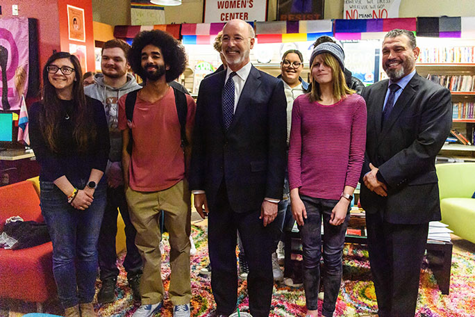 Pennsylvania Governor Wolf surrounded by students and others in the Gender and Sexuality Center