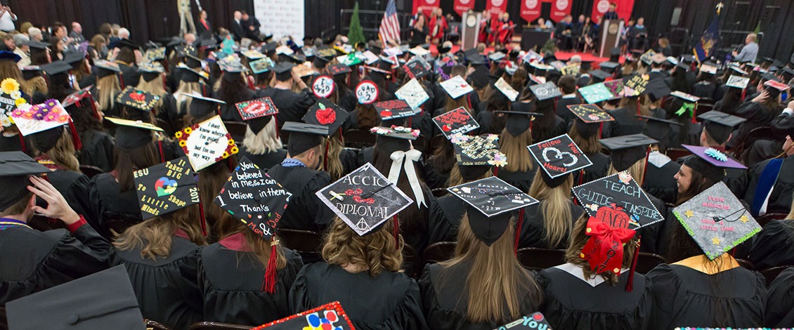 Students with decorated caps at Commencement