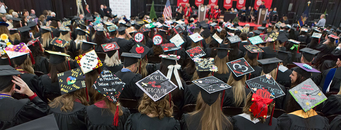 Students with decorated caps at Commencement