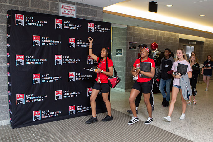 Students walking in hall during orientation