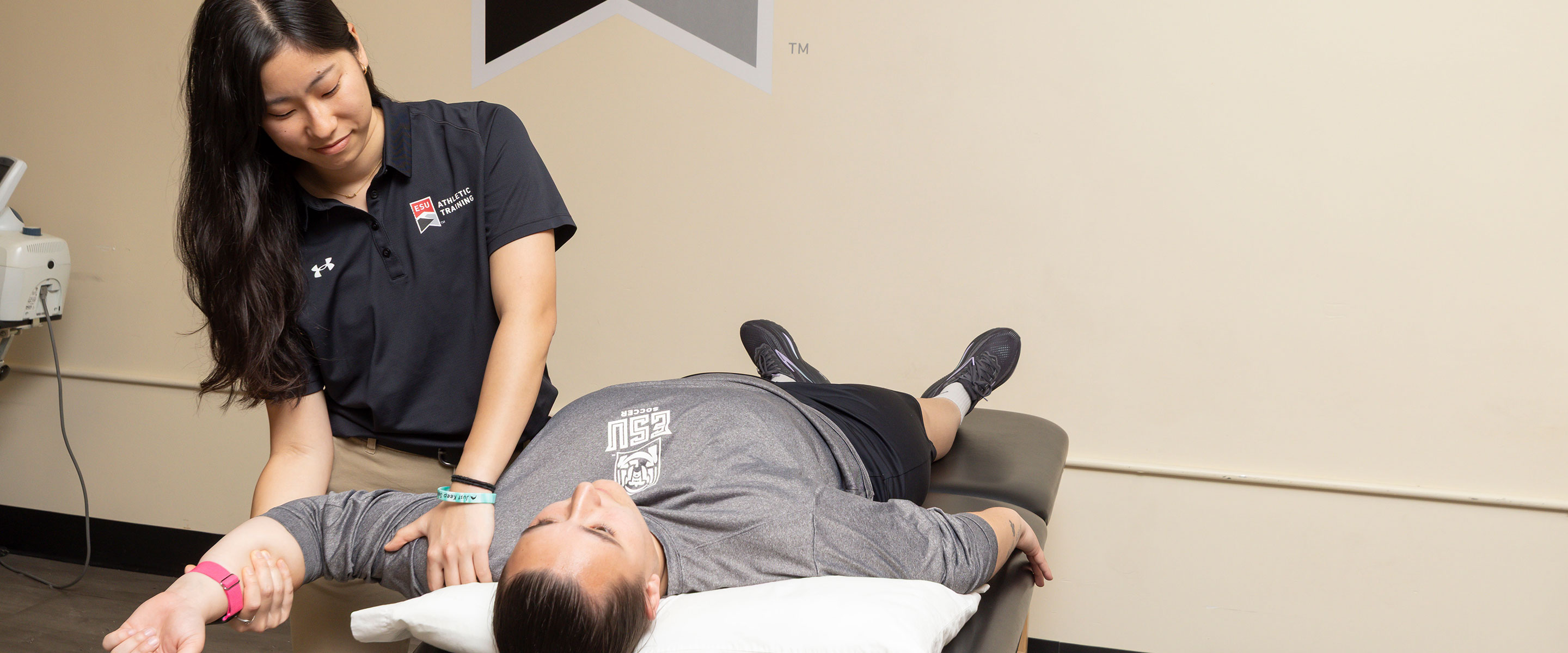Athletic Trainer working on a patient