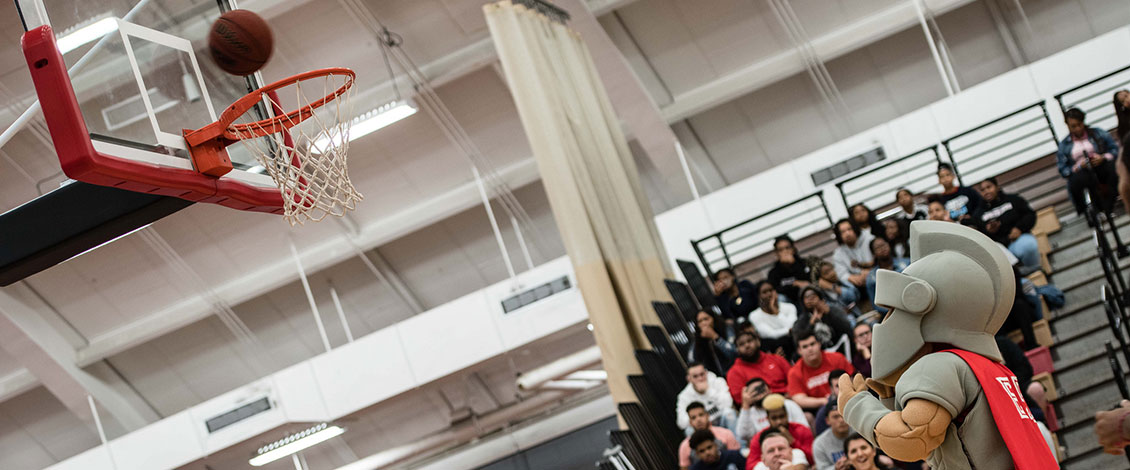 warrior mascot playing basketball