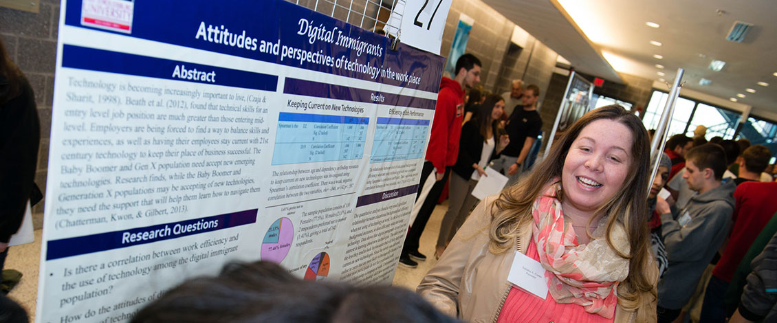 A student presenting her research