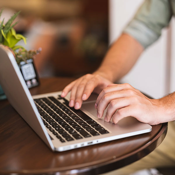 student logging into laptop
