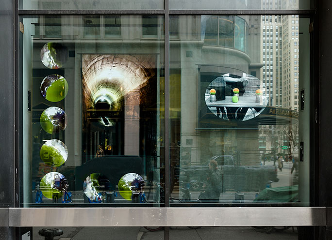 Margaret Cogswell - A view of the New York Public Library Window that presents circular images of photographs from Margaret Cogswell series of art