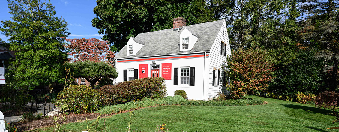 Exterior of the Multicultural House surrounded by trees