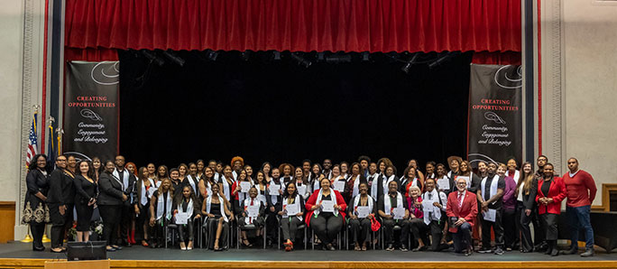 students dressed for commencement