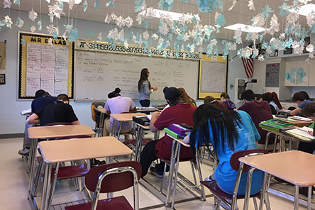 A teacher teaching secondary school students