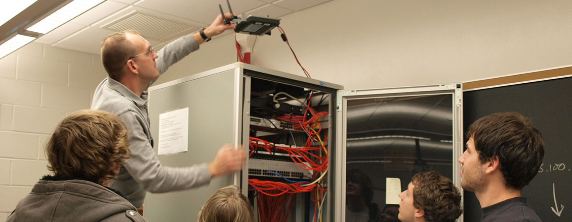 Mike Jochen installing router on top of server cabinet