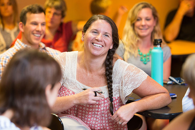 female student meeting other students