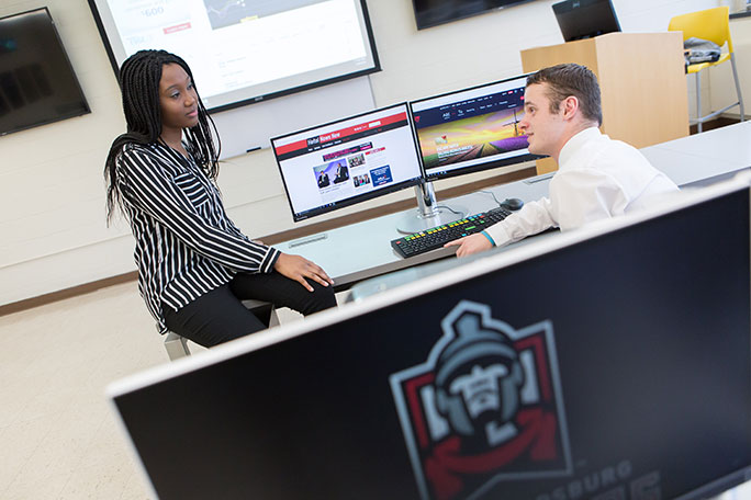 two students sitting in bloomberg lab