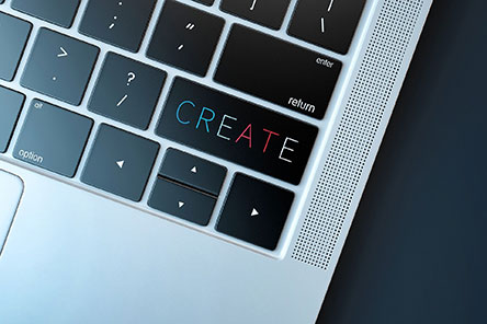 laptop keyboard with the word create on the enter button