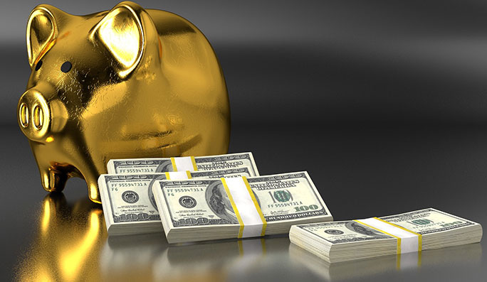 gold piggy bank with money laying around bank