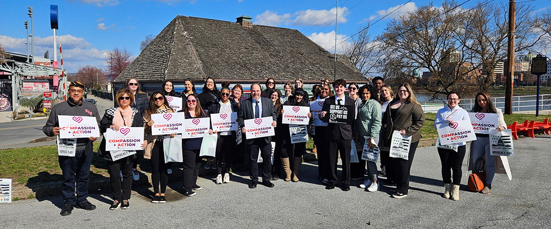 Students at Social Work Legislative Advocacy Day holding signs reading Social Workers change Futures