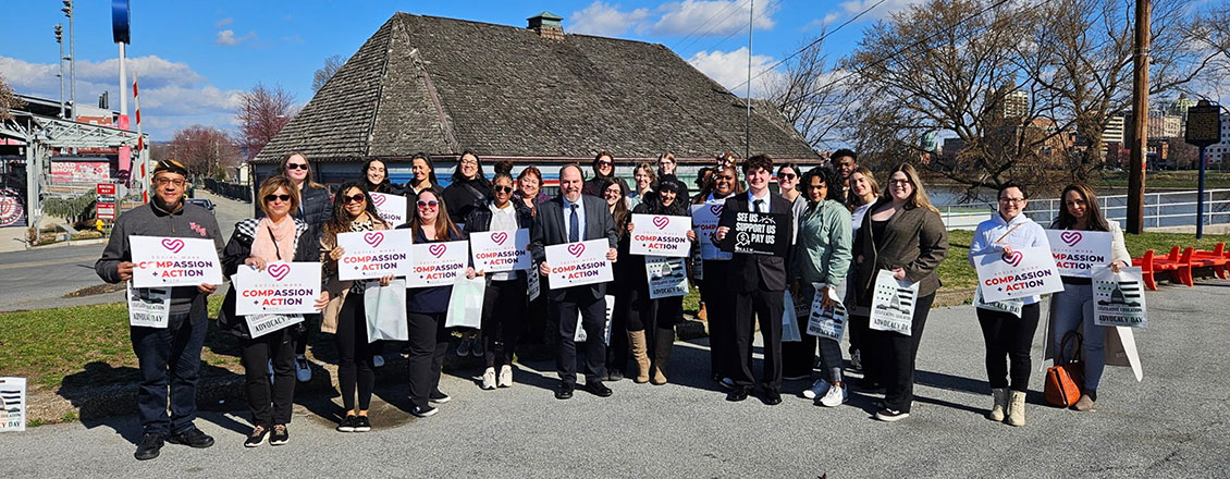 Students at Social Work Legislative Advocacy Day holding signs reading Social Workers change Futures