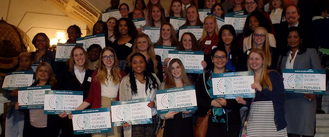 Students at Social Work Legislative Advocacy Day holding signs reading Social Workers change Futures