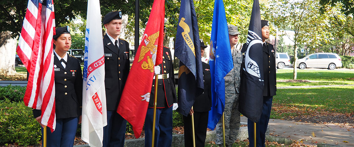 ESU students holding flags representing each of the armed forces