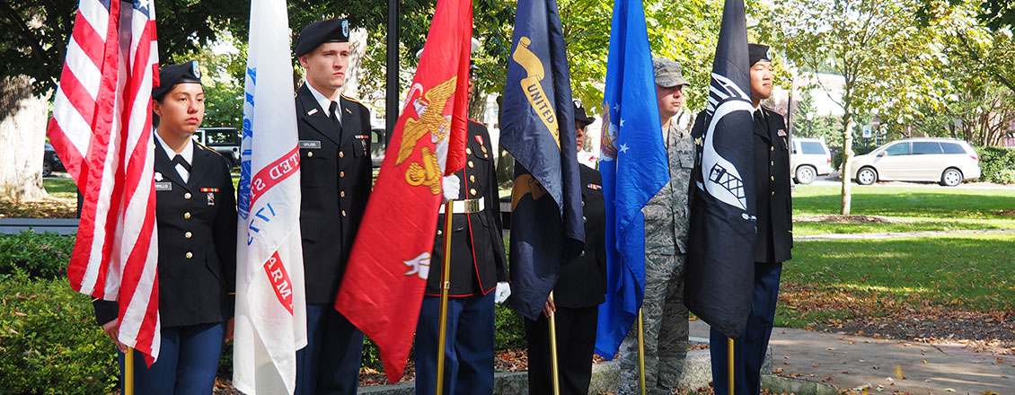 ESU students holding flags representing each of the armed forces
